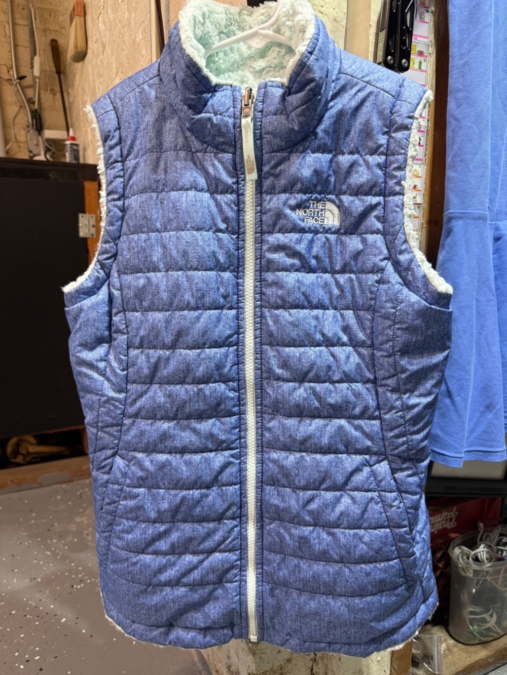 The North Face Girls' reversible Heathered Blue Quilted Vest with Sherpa Lining